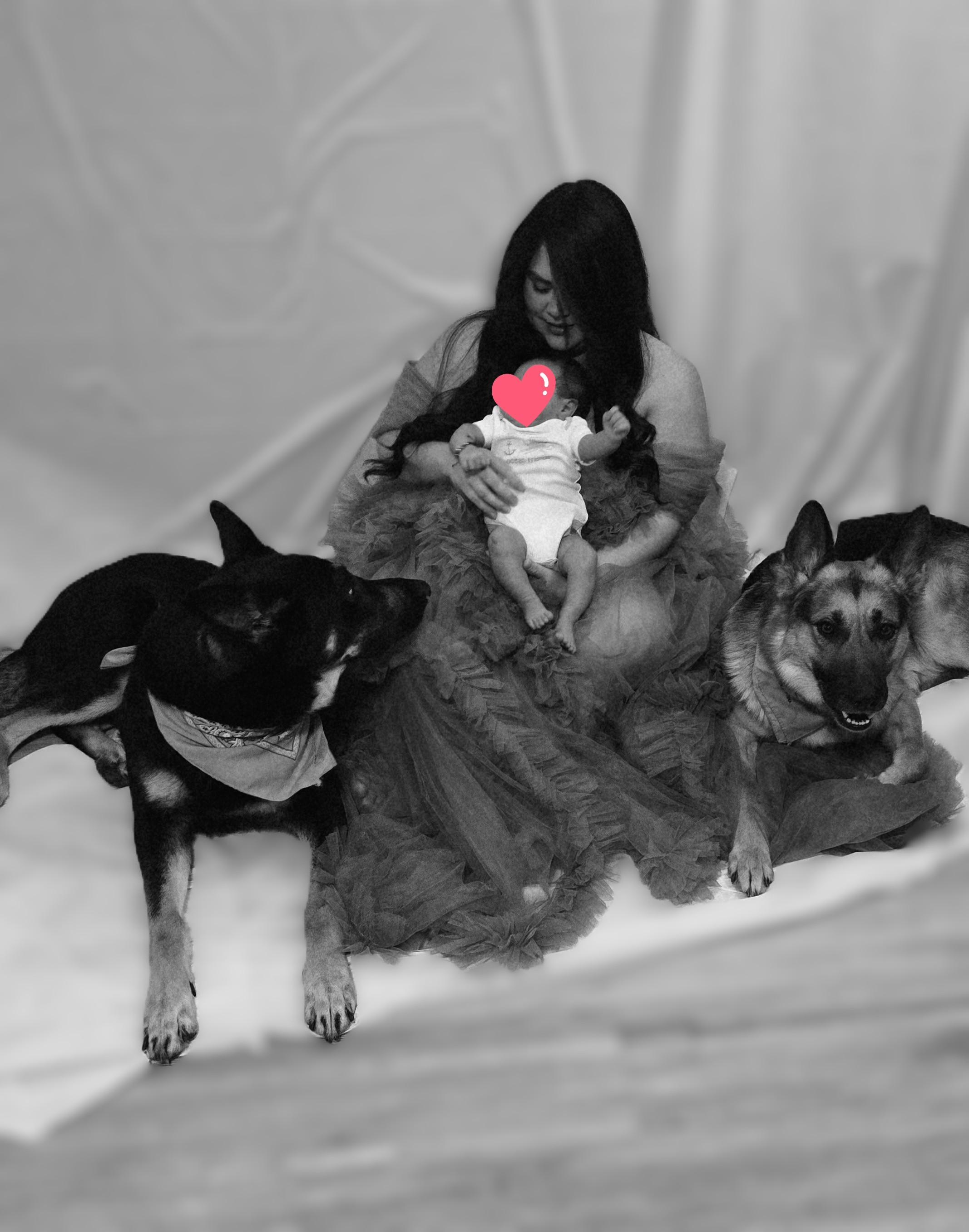 Mom with baby and German Shepherds